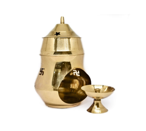 Elegant brass essential oil burner with a traditional design, perfect for diffusing fragrance oils during meditation, puja, or relaxation rituals. India’s Largest Pooja Accessories Brand – www.satvikworld.com