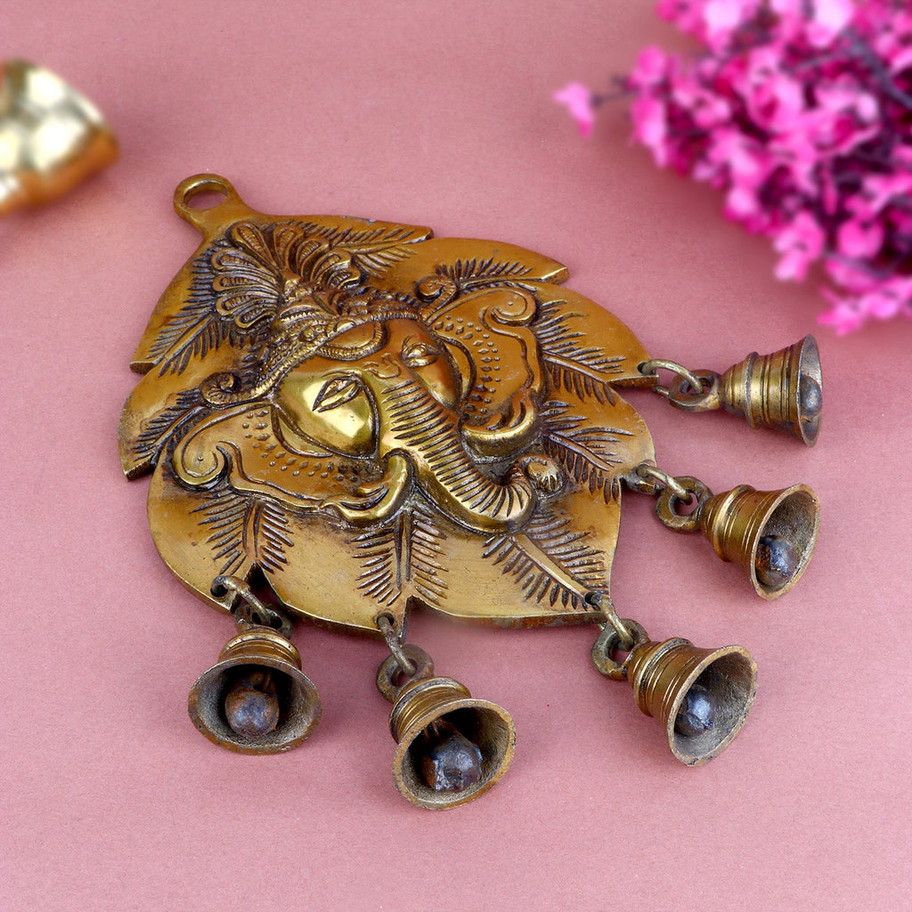 Brass decorative Ganesh wall hanging in a unique leaf shape, featuring intricate carvings of Lord Ganesha, symbolizing wisdom, prosperity, and remover of obstacles. Ideal for home decor and spiritual spaces. India’s Largest Pooja Accessories Brand – www.satvikworld.com