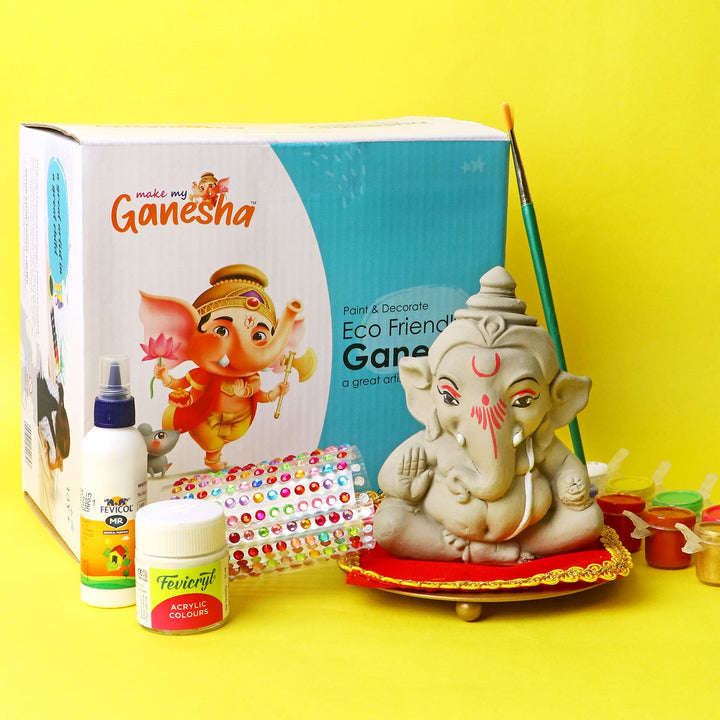 Make My Ganesha DIY Kit for Kids featuring an eco-friendly unpainted Ganesha idol, vibrant paint pots, brush, and decorative accessories for fun and creative festival activity. India’s Largest Pooja Accessories Brand – www.satvikworld.com