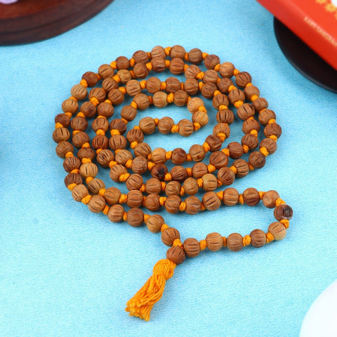 Regular wood beads with a cut design, scented Chandan Jap Mala, crafted for spiritual practices with a soothing fragrance, featuring 108+1 beads. Ideal for meditation and prayer. India’s Largest Pooja Accessories Brand – www.satvikworld.com
