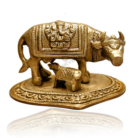 Small brass Kamdhenu cow with calf idol, intricately crafted to symbolize divine nourishment, prosperity, and spiritual abundance. Perfect for worship, home décor, or as a symbol of blessings. India’s Largest Pooja Accessories Brand – www.satvikworld.com