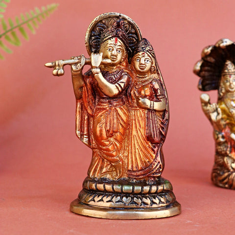 Brass small Radha Krishna statue, delicately crafted to capture the divine bond between Radha and Krishna. Ideal for home temples, spiritual spaces, or as a meaningful gift symbolizing love and devotion. India’s Largest Pooja Accessories Brand – www.satvikworld.com
